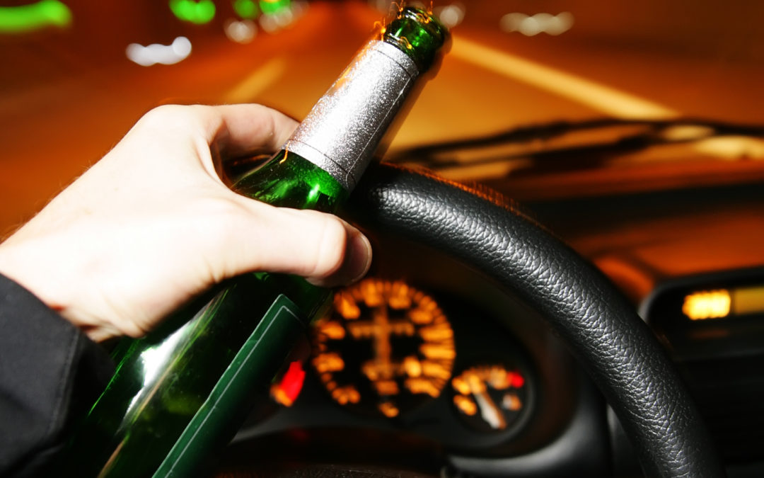 What do I do if I see a drunk driver on the road?